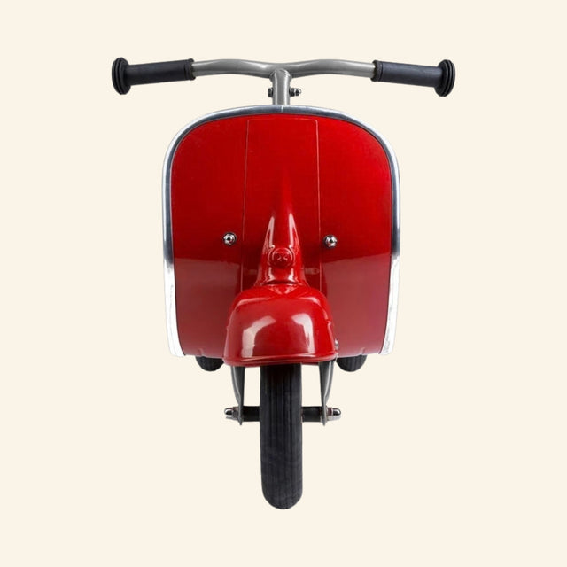 Front view of the AMBOSSTOYS PRIMO ride-on toy scooter in red with chrome trim and black handlebars.
