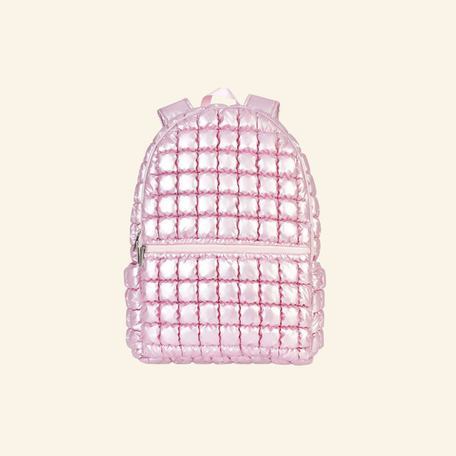 iScream Icy Rose Puffer Backpack shown from the front, featuring shiny metallic pink quilted nylon, a rounded top, front zippered pocket, top handle, and padded shoulder straps.