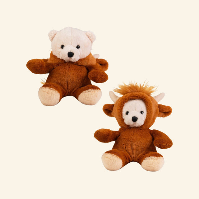 Keycraft Little Dress Up Bear – Highland Cow shown two ways, with one mini bear wearing the brown Highland cow costume hood and another bear shown with the removable hood pulled back to reveal its cream plush head.