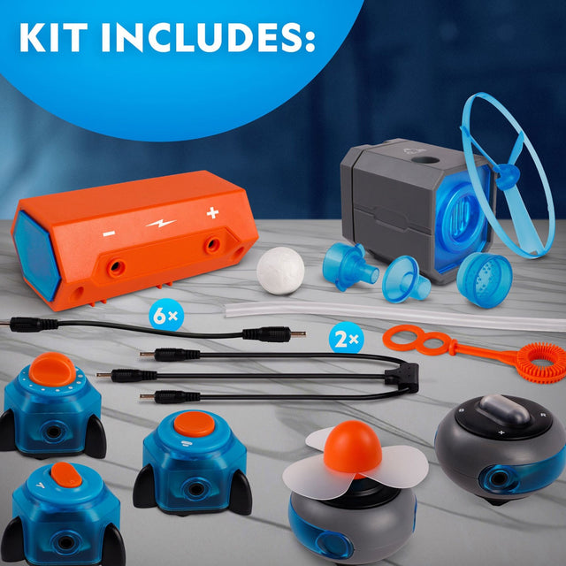 Science experiment kit with various components on a gray surface.