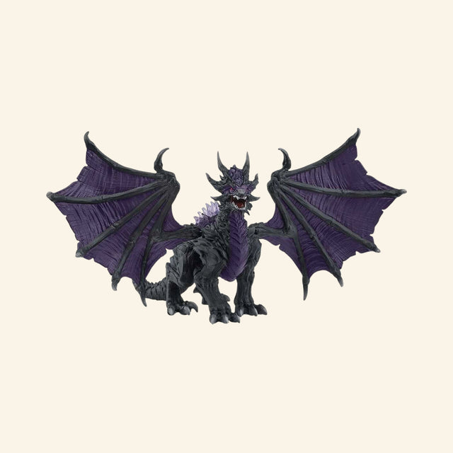 Schleich® ELDRADOR® Creatures Shadow Dragon shown from the front with wide black-and-purple wings, fierce face, sharp claws, and spiked fantasy creature details.
