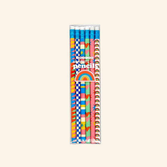 Snifty Geo Love Set of 6 Pencils shown in clear boxed packaging, featuring six full-wrap graphite pencils with white erasers and colorful designs including hearts, rainbows, checkerboards, stripes, stars, and geometric patterns.