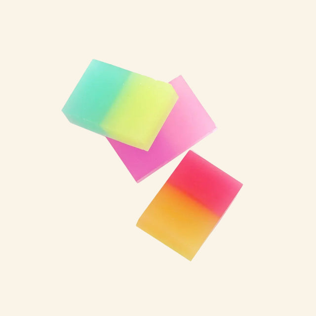 Snifty Jelly Jelly Scented Erasers shown unboxed as three colorful rectangular erasers with soft gradient layers in teal, yellow, pink, orange, and red.