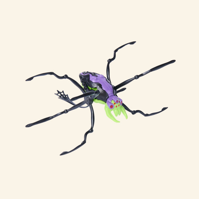 Spin Master HEX BOTS Skitter Bot Spider shown unboxed in a purple, black, and green colorway with long articulated spider legs and bright green front details.
