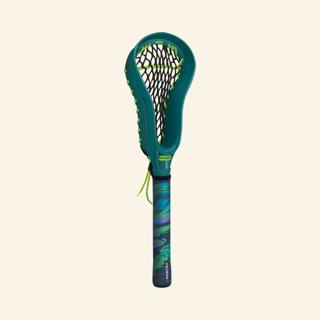 Front view of a single Waboba Urban LAX mini lacrosse stick showing the green head, black netting, blue-green handle, and small loose green string detail.