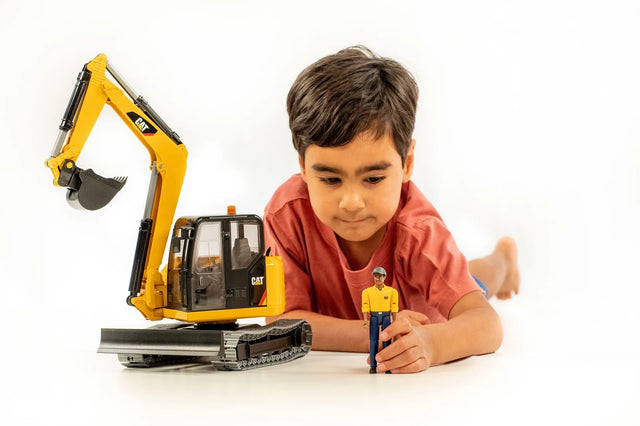 Cat® Mini Excavator with worker