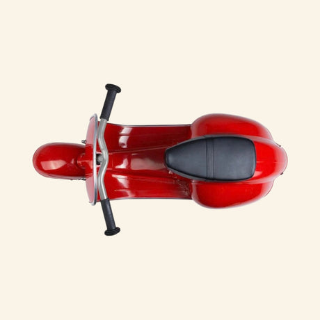 Top view of the AMBOSSTOYS PRIMO ride-on toy scooter in red showing the black seat and handlebar layout.
