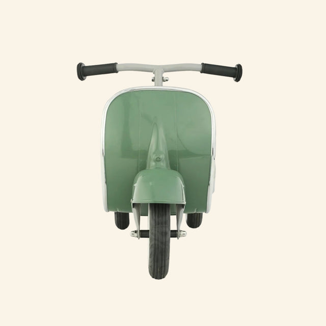 Front view of the AMBOSSTOYS PRIMO sage green ride-on toy with a brown seat.