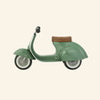 Side view of the AMBOSSTOYS PRIMO sage green ride-on toy with a brown seat.