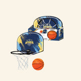 Anywhere Sports Hot Shot Basketball Hoop shown with blue and yellow backboard, black hoop, white net, orange foam basketball, and colorful retail packaging behind it.
