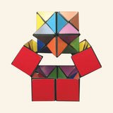 California Creations The Amazing Starcube opened into a symmetrical shape with red square panels at the bottom, colorful triangle panels in the center, and cube sections stacked at the top.