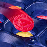 Yellow and red plastic discs with the number 4 in a blue game base.