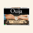 Continuum Games Classic Ouija Board retail box showing hands using the plastic message indicator on the original-style wood Ouija board with Mystifying Oracle packaging.