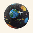 Crocodile Creek Space Exploration playground ball with a black textured surface decorated with Earth, planets, stars, a space shuttle, satellite, and colorful outer-space graphics.