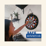 Child playing Doinkit Darts Rollup Magnetic Dartboard mounted on a wall with magnetic safety darts.