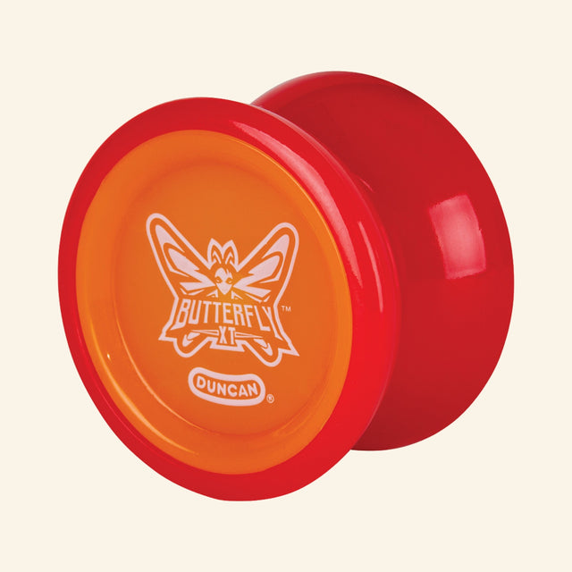 Duncan Butterfly XT Yo-Yo shown unboxed in orange and red, highlighting the wide butterfly shape, rounded profile, and white Butterfly XT logo on the orange center.