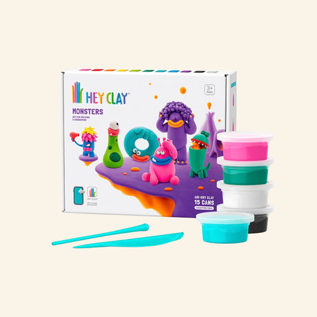 Fat Brain Toys Hey Clay – Monsters set shown with retail box, stacked colorful clay containers, sculpting tools, and finished monster character examples.