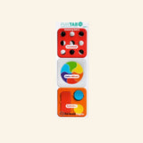 Fat Brain Toys PlayTab Set of Three Sensory Tiles – Set #2 shown as a vertical set of three magnetic activity tiles, including a red tactile button tile, colorful spinning color wheel tile, and orange slider-and-button sensory tile.