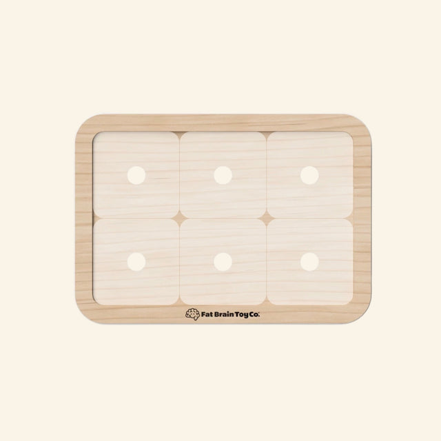 Fat Brain Toys PlayTab Modular Activity Board shown empty, featuring a wooden tablet base with six magnetic tile spaces and rounded corners.
