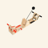 Fat Brain Toys VolleyShot Game shown from a side angle, highlighting the wooden paddle controls, attached ball arm, center scoring area, and compact tabletop design.