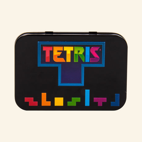 Fizz Creations Tetris Arcade in a Tin shown closed, featuring a black tin case with the colorful Tetris logo and multicolor Tetrimino block artwork along the bottom.