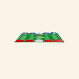Assembled Foosbots Rivals Cup felt soccer field with barriers and built-in score sliders ready for tabletop play.