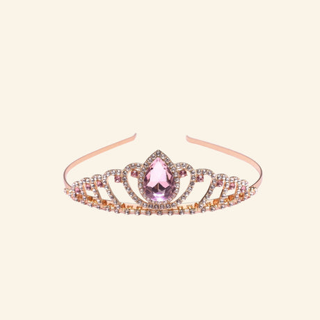 Great Pretenders Boutique Regal Tiara shown in rose gold with sparkling rhinestones, curved crown detailing, and a large pink teardrop gemstone centerpiece.