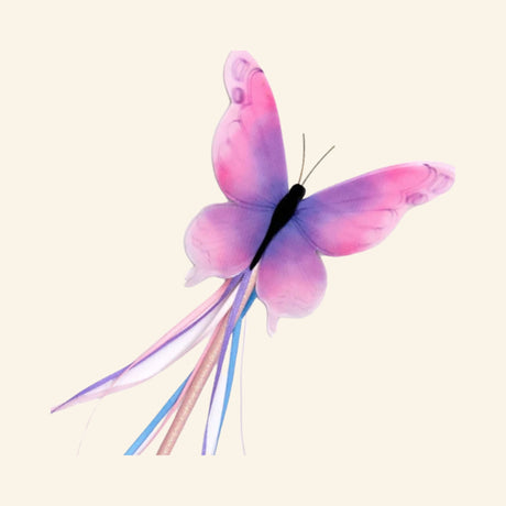 Close-up of the Great Pretenders Float Like a Butterfly Wand showing the pink and purple butterfly topper with flowing pastel ribbon tassels.