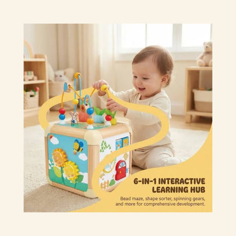 Toddler playing with the Hape Green Thumbs Activity Cube in a bright playroom, using the bead maze and garden-themed activity panels on the wooden cube.