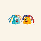 Hape Noisy Alien toys shown out of the box in teal and orange with soft rounded bodies, big expressive eyes, and colorful pullable rope hair.