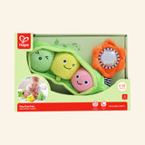 Hape Pea Pod Pals shown in front-facing retail packaging with a green plush pea pod, three smiling plush peas, orange rattling flower, baby play photo, and age 6–24 months guidance.