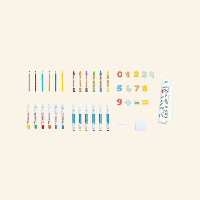 Hape Portable Art & Learn Set contents laid out in rows, showing colored pencils, crayons, washable markers, magnetic numbers, eraser, paper roll, and creative accessories included in the set.