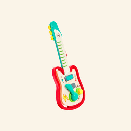 Hape Rainbow Rock Guitar shown unboxed with a red body, green neck, turquoise accents, whammy bar, colorful buttons, and playful musical graphics.