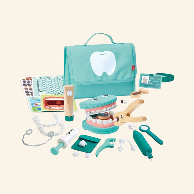 Hape Super Smile Dental Clinic Set contents displayed with turquoise carrying case, mouth model with removable teeth, toothbrush, dental mirror, drill, syringe, tongs, activity cards, pretend braces, and dental accessories.