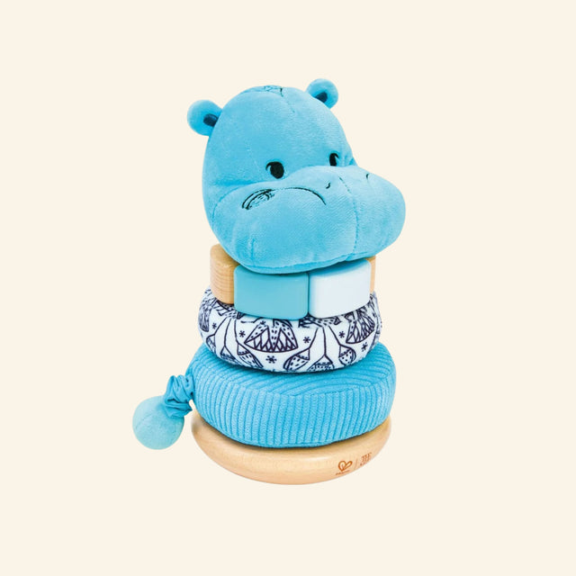 Hape The Met Collection William Stacker fully assembled with a soft blue hippo topper, stacked blue and patterned rings, wooden base, and calming museum-inspired design.