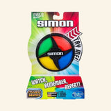 Hasbro Gaming Simon Micro Game in retail packaging showing the compact round Simon game with green, red, yellow, and blue light-up buttons, “Watch, Remember, Repeat!” text, Micro Series branding, and age 8+ guidance.