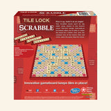 Back of the Hasbro Tile Lock Scrabble retail box showing the tile-lock gameboard, letter tiles, instructions callouts, contents list, and travel-friendly board features.
