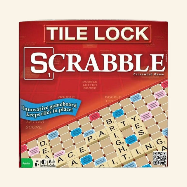 Hasbro Tile Lock Scrabble retail box front showing the red Scrabble packaging, tile-lock gameboard artwork, letter tiles, and callout that the board keeps tiles in place.