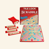 Hasbro Tile Lock Scrabble game contents shown with retail box, red tile bag, letter tiles, plastic tile racks, and tile-lock Scrabble gameboard.