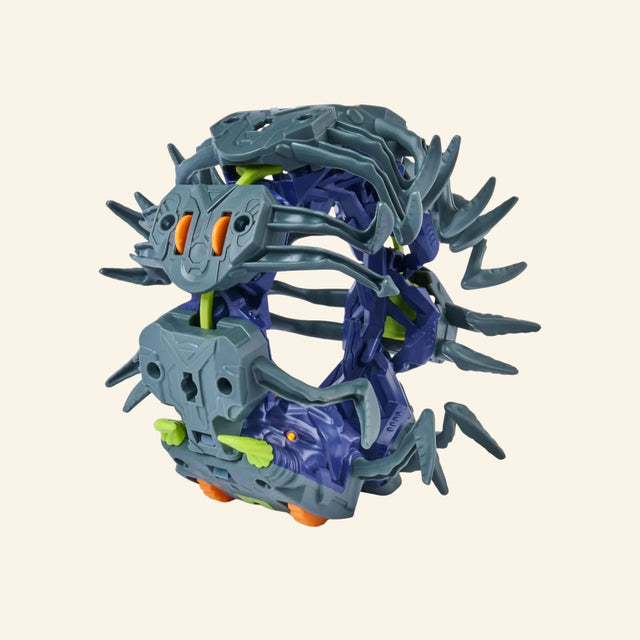 HEX BOTS Explodapede folded into a compact ball before transforming into a crawling robotic centipede.