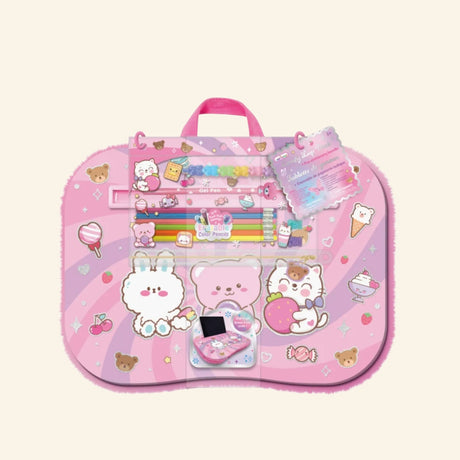 Hot Focus Comfy Lap Desk – Critters shown in packaging with a pastel pink cushioned lap desk covered in cute bunny, bear, cat, candy, cherry, heart, and ice cream artwork, plus visible gel pen and erasable color pencil accessories.