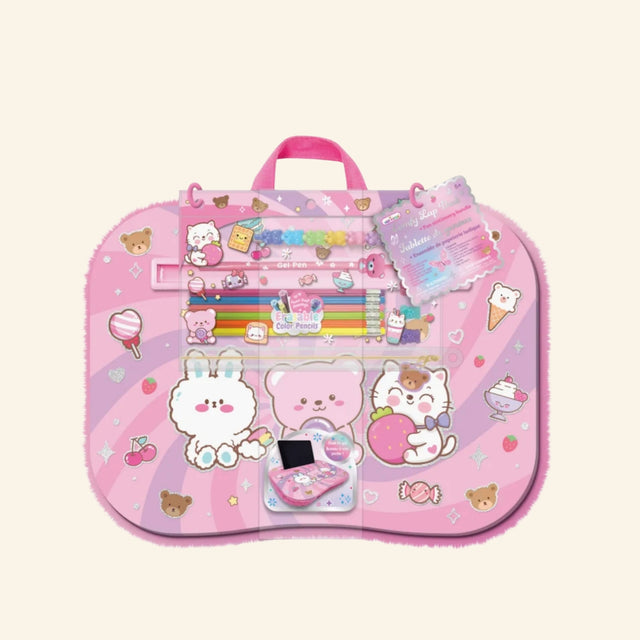 Hot Focus Comfy Lap Desk – Critters shown in packaging with a pastel pink cushioned lap desk covered in cute bunny, bear, cat, candy, cherry, heart, and ice cream artwork, plus visible gel pen and erasable color pencil accessories.