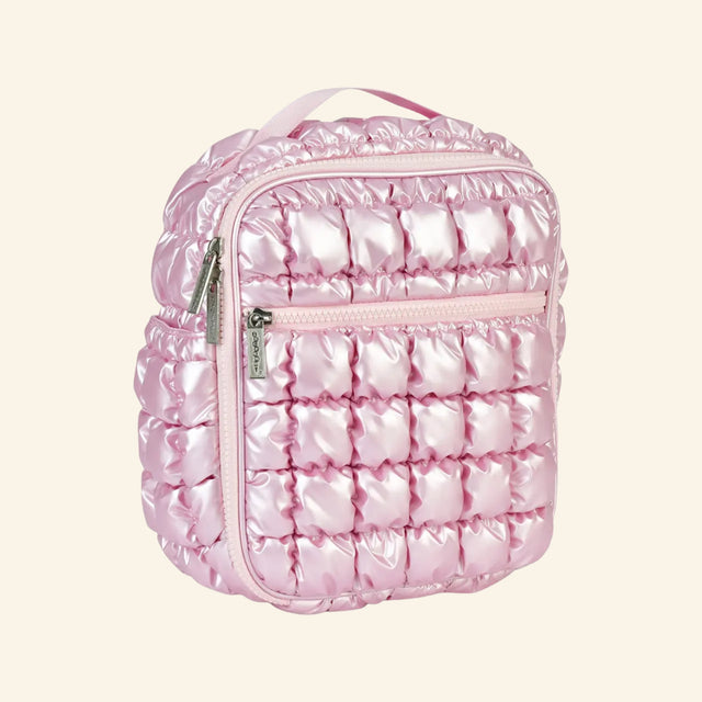 iScream Icy Rose Puffer Lunch Tote shown from an angled side view, highlighting the glossy pink quilted puffer texture, side pocket, front zipper pocket, top handle, and rounded zipper closure.