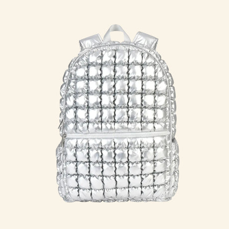 iScream Icy Silver Puffer Backpack shown from the front, featuring shiny metallic silver quilted nylon, a rounded top, front zippered pocket, top handle, and padded shoulder straps.