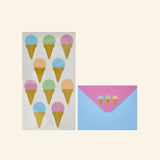 iScream Sweet Scoops stationery pieces showing an ice cream cone sticker sheet and a blue envelope with pink flap decorated with small pastel ice cream cones.