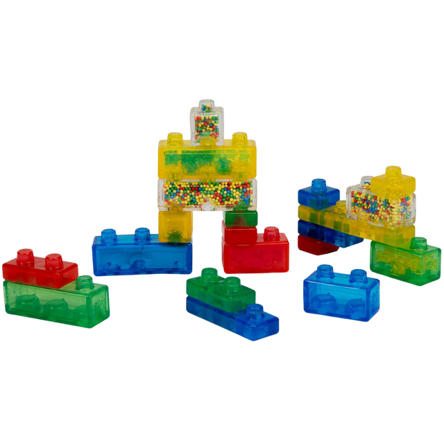 Colorful building blocks with transparent bricks on a white background