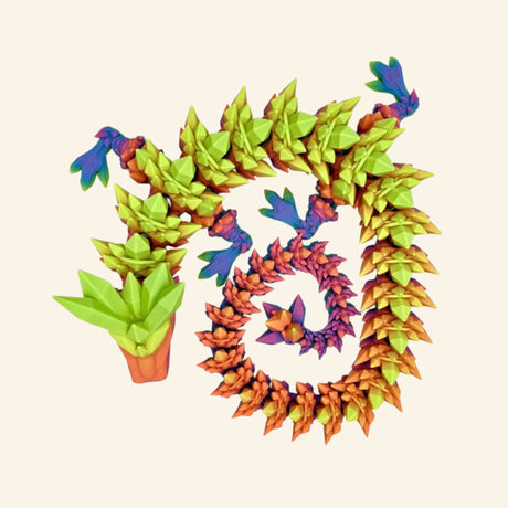 umbo articulated crystal dragon coiled into a spiral, featuring layered pointed scales in green, yellow, orange, pink, purple, and blue with a large green dragon head and multicolored feet.