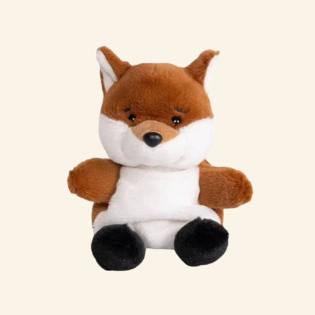 Keycraft Living Nature Little Snugglies Woodland fox plush shown seated with reddish-brown fur, white face and belly, black paws, pointed ears, and a soft rounded body.