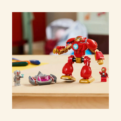 LEGO® Marvel Ultron vs. Iron Man play scene with the red Iron Man mech, Iron Man and Ultron minifigures, and Ultron’s flying vehicle displayed on a tabletop.