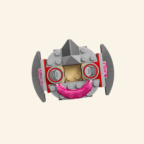 Close-up of Ultron’s small LEGO® flying vehicle from the Ultron vs. Iron Man set, showing gray side pieces, pink front detail, and a seat for the Ultron minifigure.